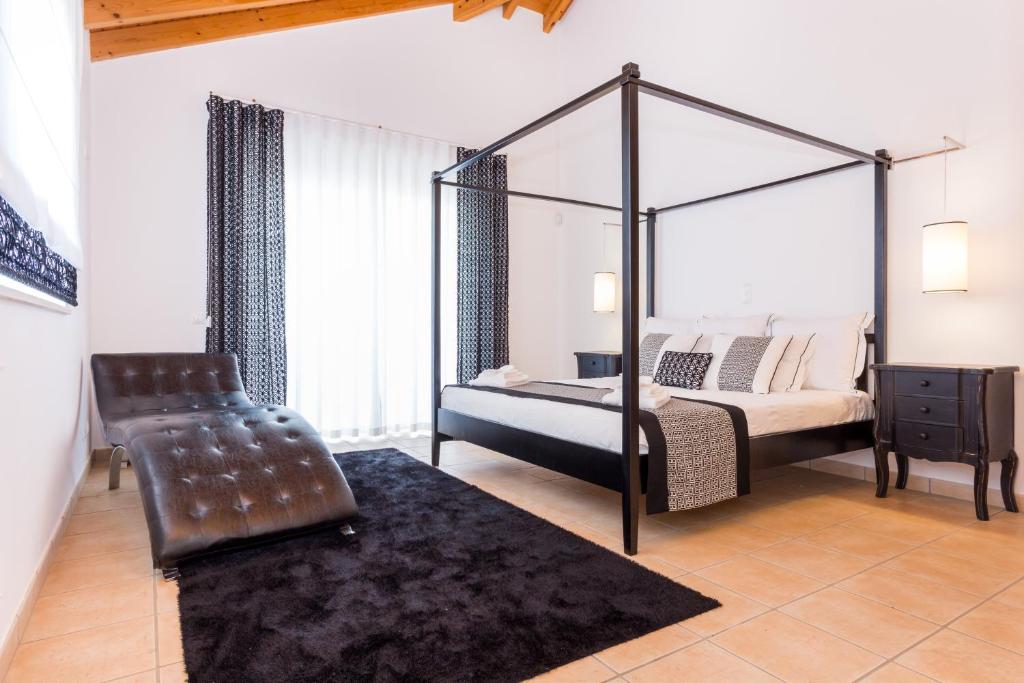 Postel nebo postele na pokoji v ubytování Villa Zinha