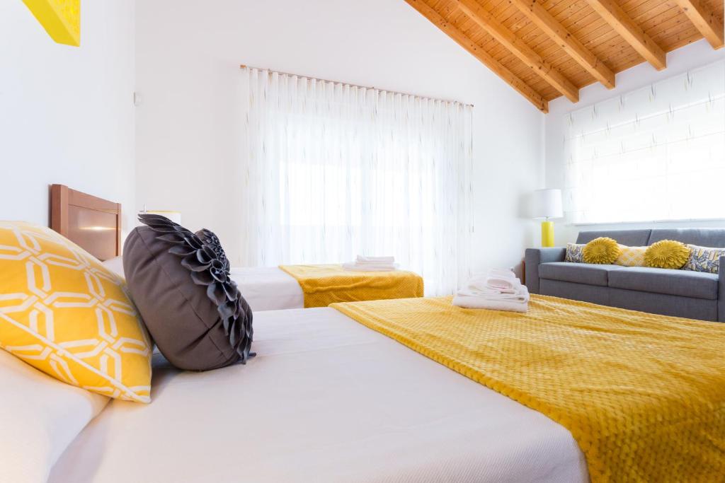 Postel nebo postele na pokoji v ubytování Villa Zinha