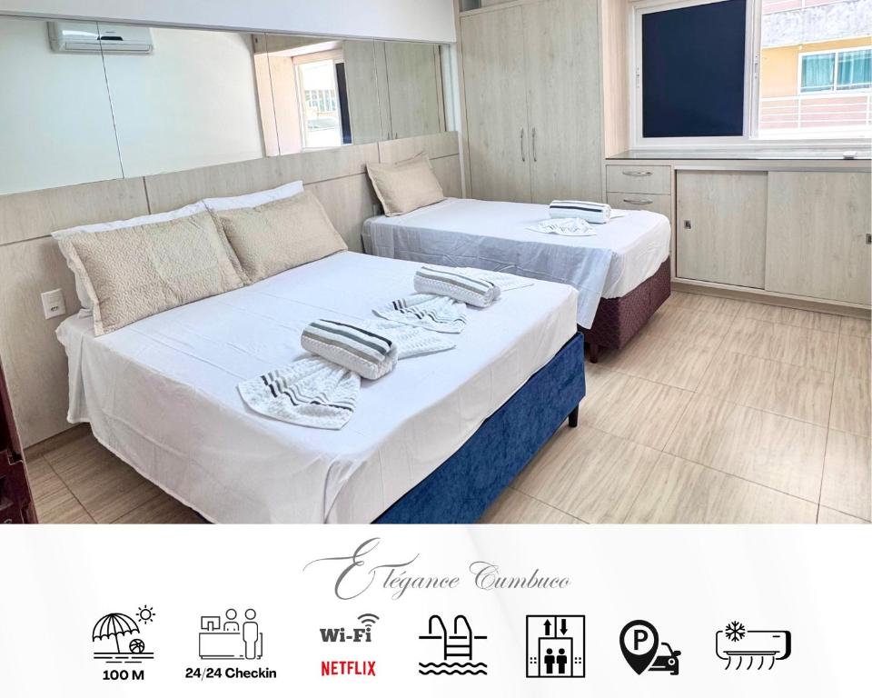 a hotel room with two beds with towels on them at Elegance Residences Cumbuco in Cumbuco