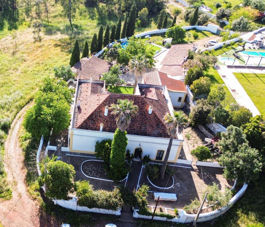 an aerial view of a house with a pool at Palacete Dos Alcaides in Minas de São Domingos