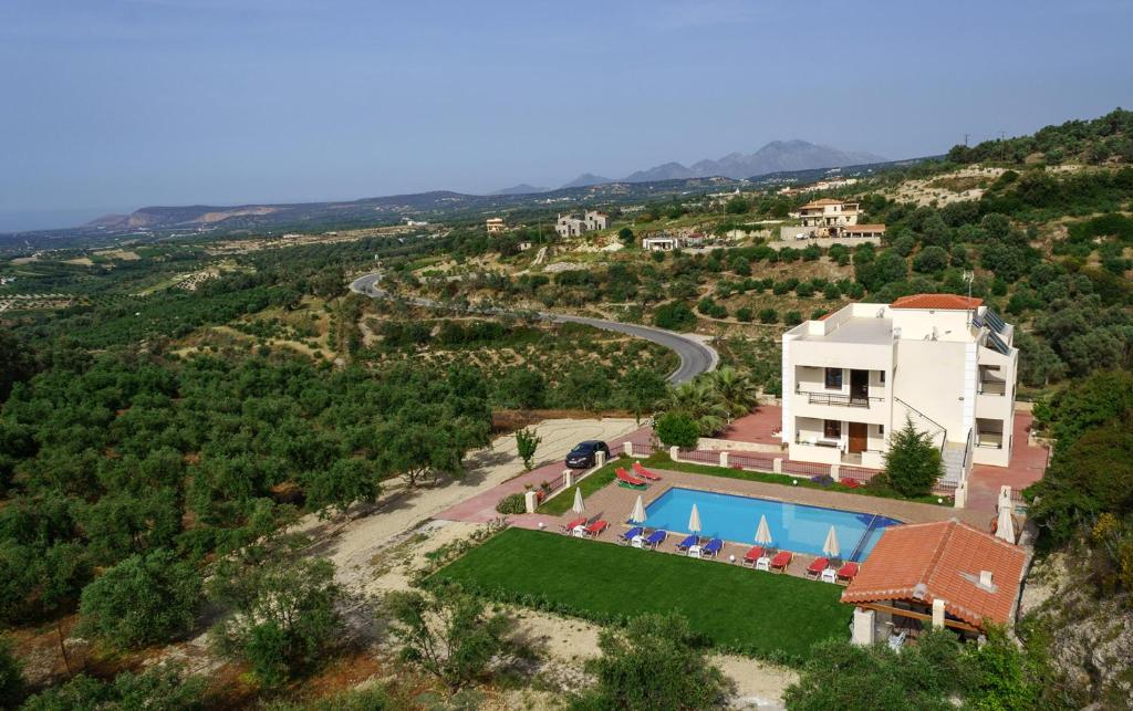 an aerial view of a villa with a swimming pool at Villa Laga with Pool, 300m to Taverns, Childrens Area, BBQ! in Kiriánna