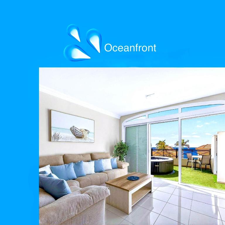 a living room with a couch and a table at Villa Brisa Serena - Oceanfront - Los Cristianos in Los Cristianos