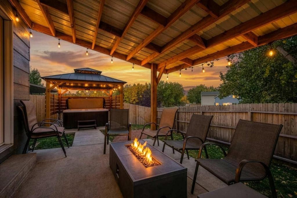 a patio with a gazebo and a table and chairs at Hearth Haven - Hot Tub BBQ Large Groups in Colorado Springs