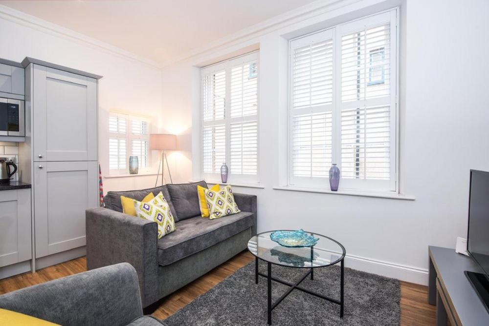 a living room with a couch and a table at Fifty Two Old Elvet in Durham