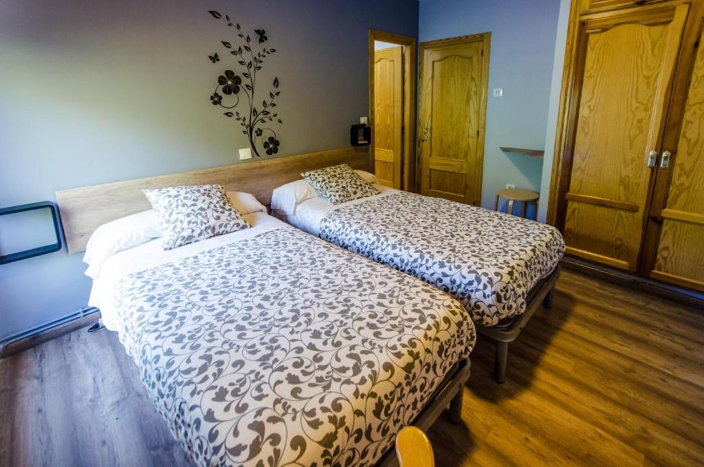 Posteľ alebo postele v izbe v ubytovaní Hostal La Pastora