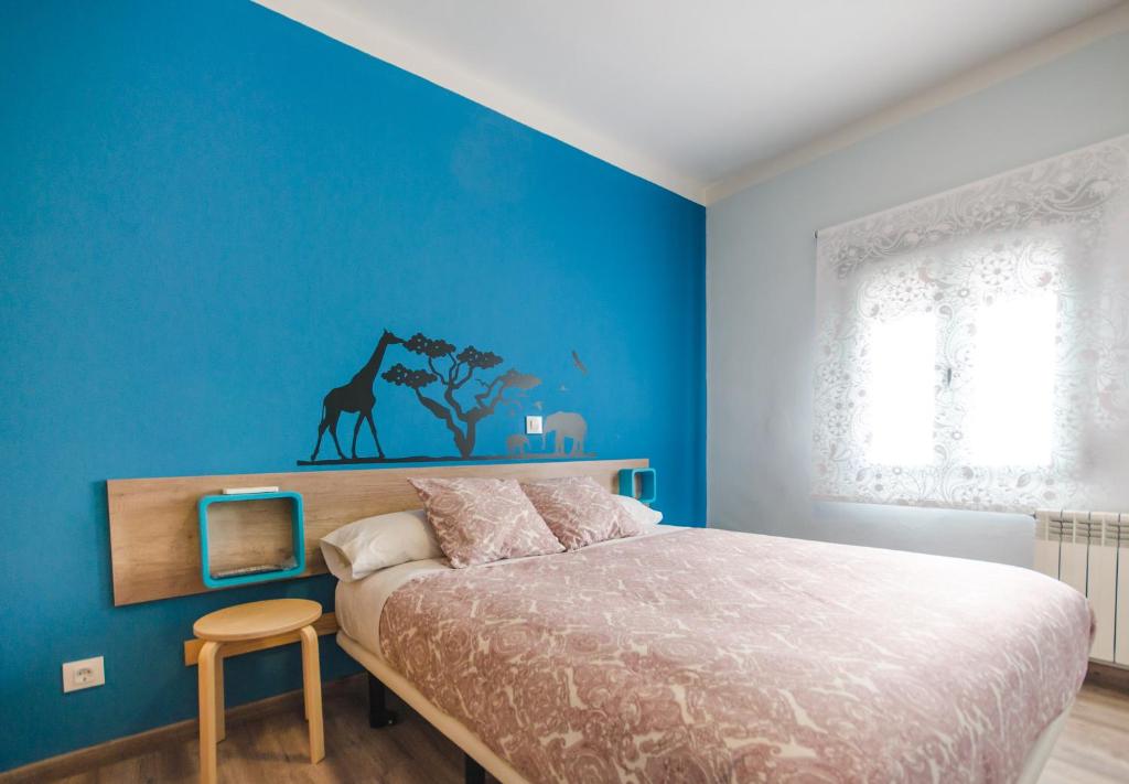 Posteľ alebo postele v izbe v ubytovaní Hostal La Pastora