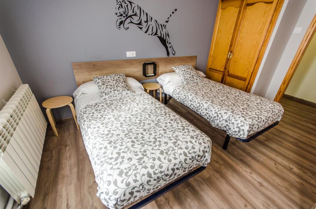Posteľ alebo postele v izbe v ubytovaní Hostal La Pastora
