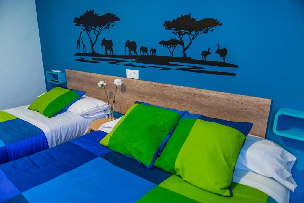 Posteľ alebo postele v izbe v ubytovaní Hostal La Pastora