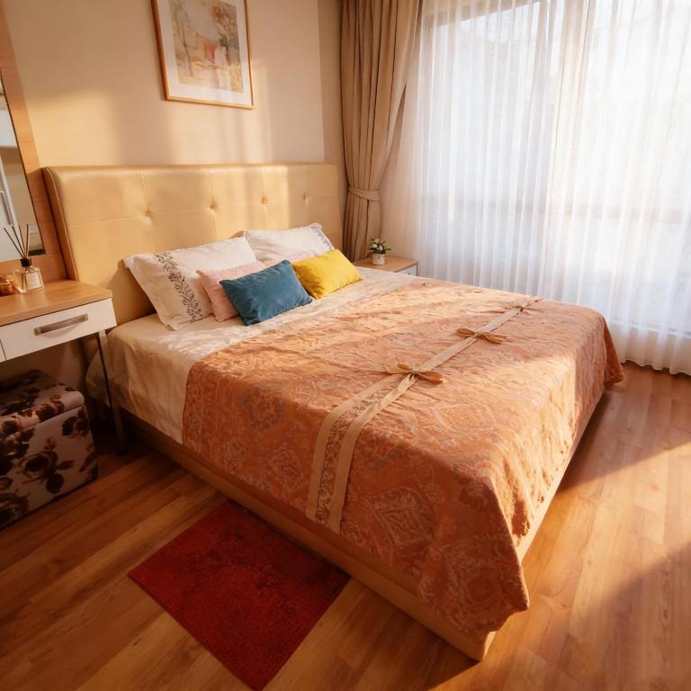 a bedroom with a bed with two pillows on it at treasure swimming condo in Chiang Mai