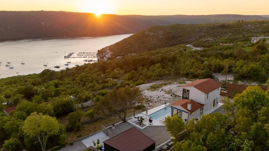 an aerial view of a house with a view of the water at Vila Laguna Blu by Villas Guide in Trget