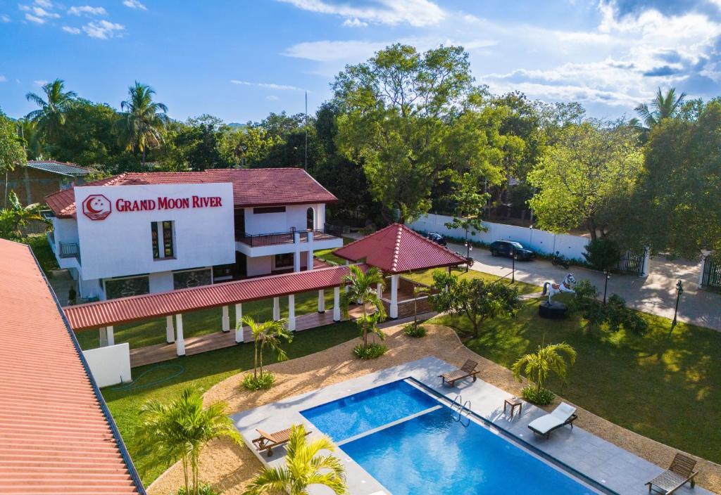 an aerial view of a resort with a swimming pool at The Grand Moon River Hotel in Kataragama