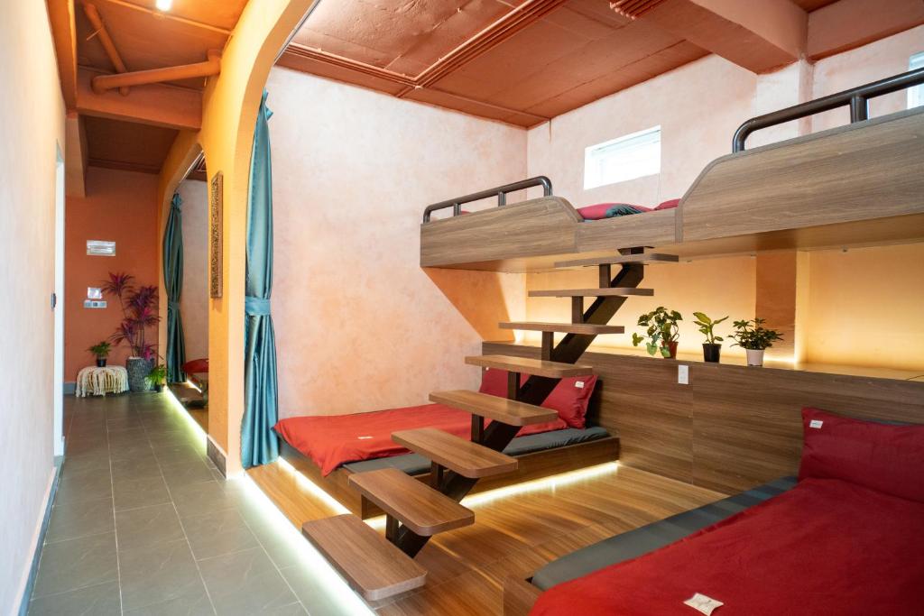 a room with two bunk beds and a bed at Dahill 196 Dalat in Da Lat
