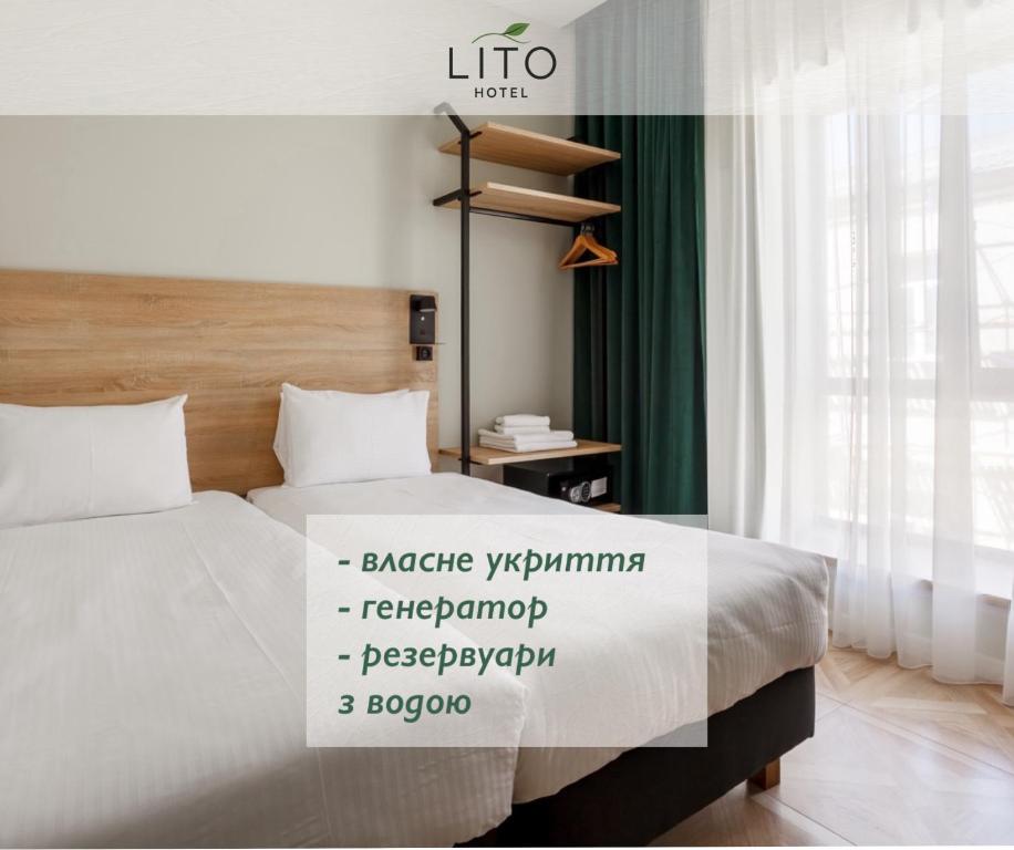 a hotel room with a bed with a sign on it at LITO Hotel in Odesa