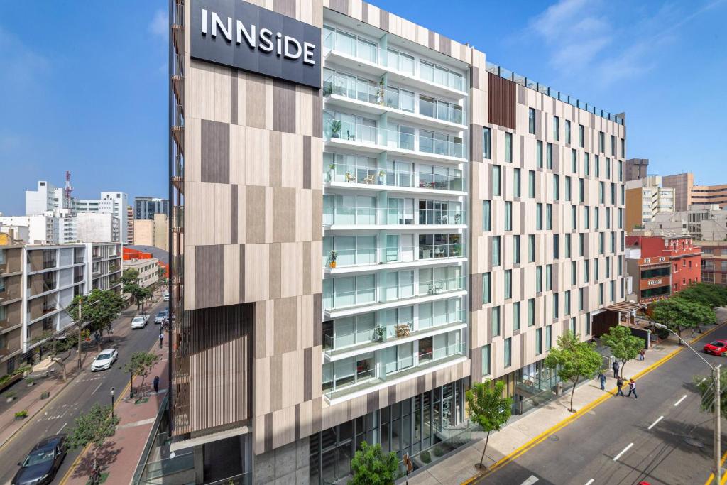 a building with a sign on the side of it at INNSiDE by Meliá Lima Miraflores in Lima