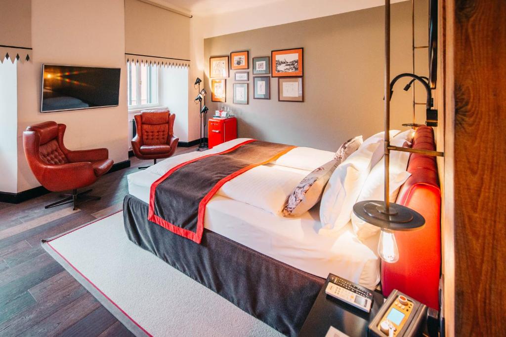 Televízia a/alebo spoločenská miestnosť v ubytovaní PEST-BUDA Design Hotel