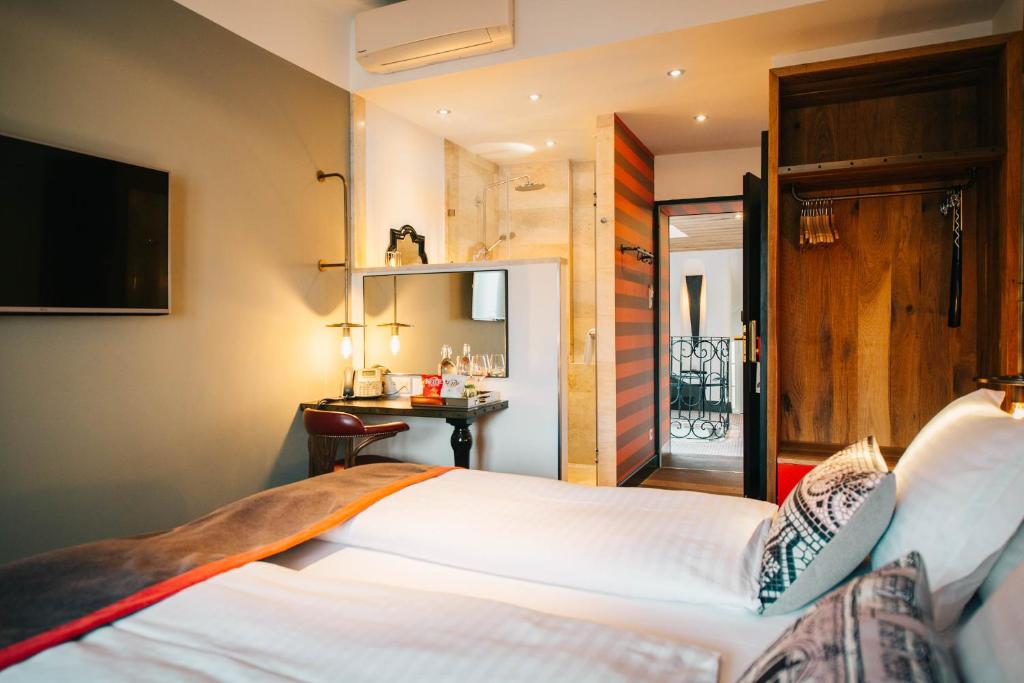 Posteľ alebo postele v izbe v ubytovaní PEST-BUDA Design Hotel