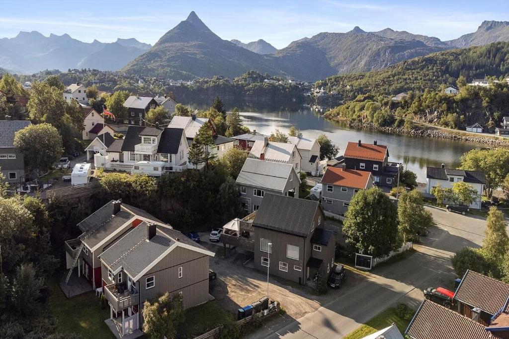 an aerial view of a town with a river and mountains at Apartment close to the mountain in Svolvær