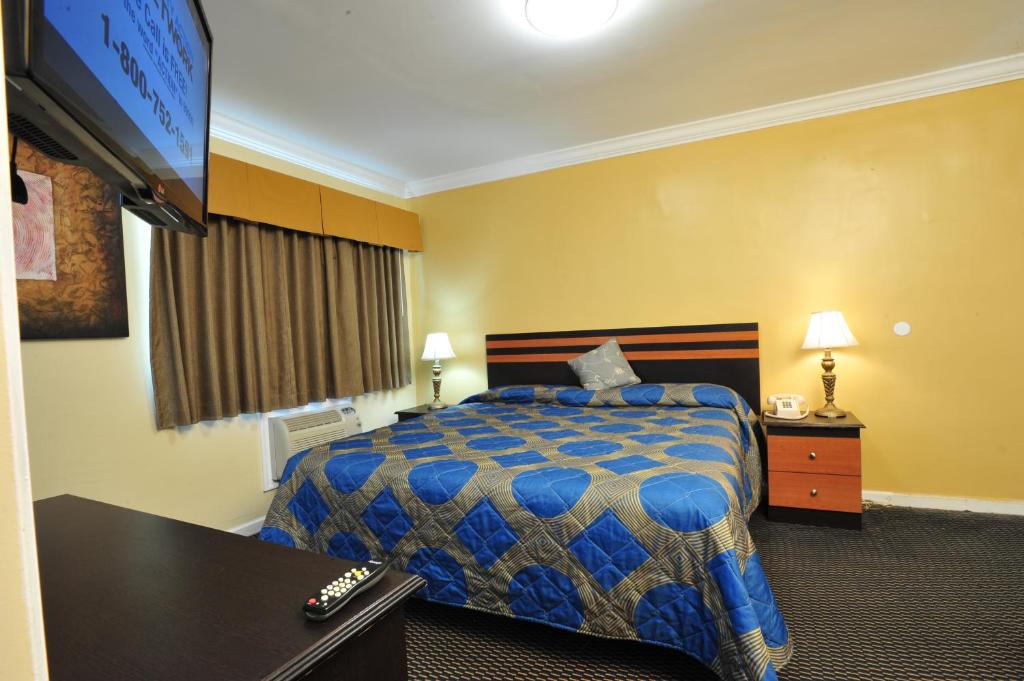 Postel nebo postele na pokoji v ubytování King Motel - Miami