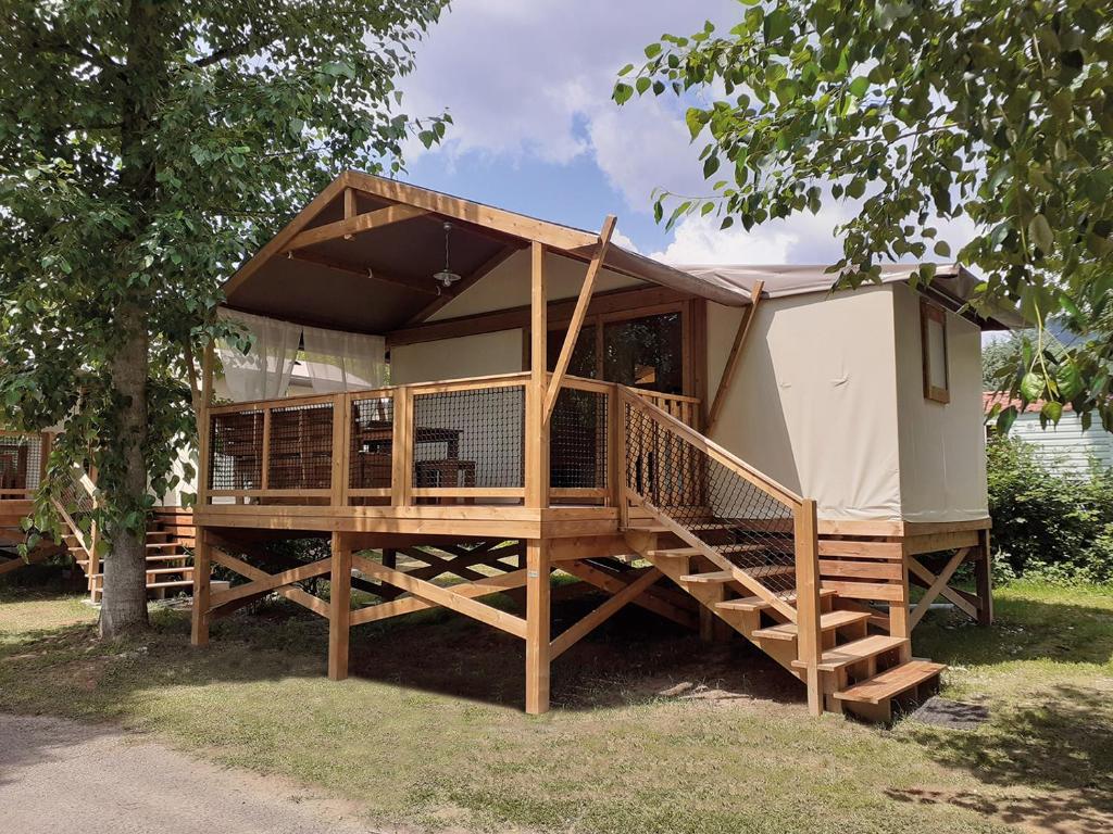 a tiny house with a deck and a staircase at Domaine de la Forge in La Teste-de-Buch