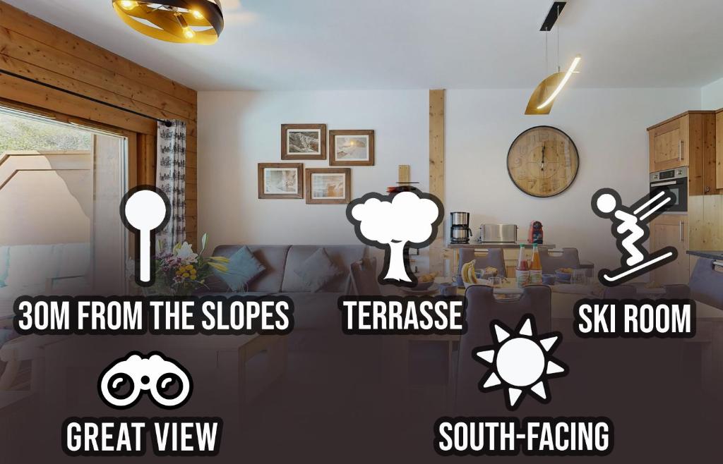 a living room with various stickers on the wall at Elégant logement, Superbe vue in Champagny-en-Vanoise