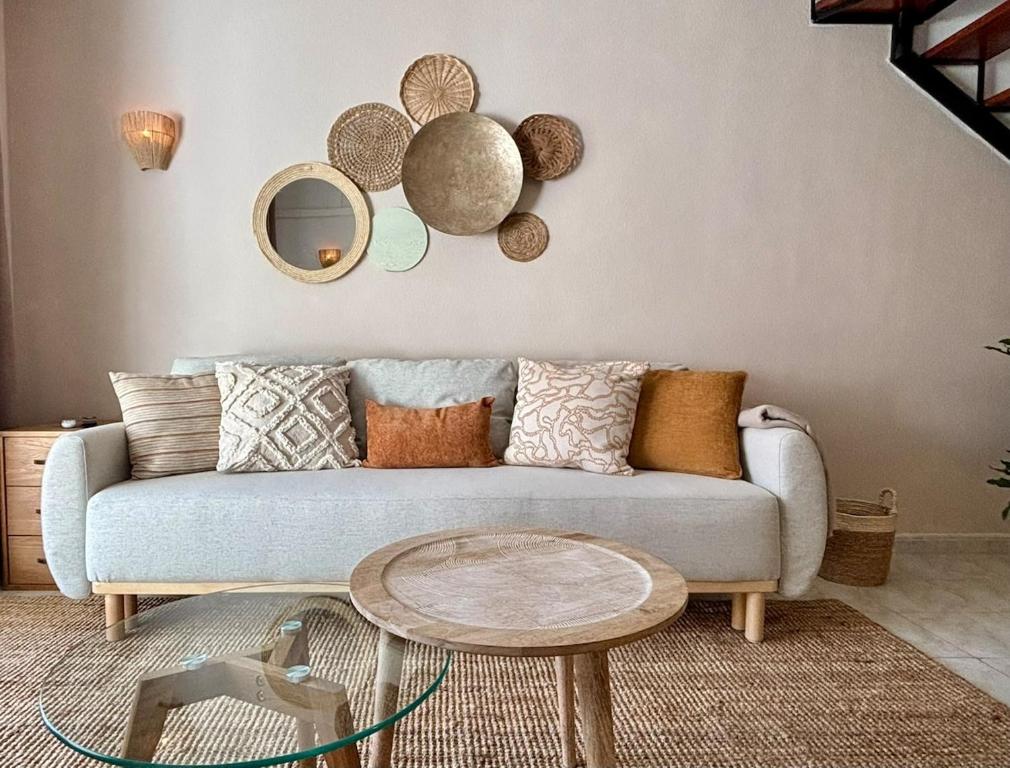 a living room with a couch and a table at Casa Verde 56 in Cumbre del Sol