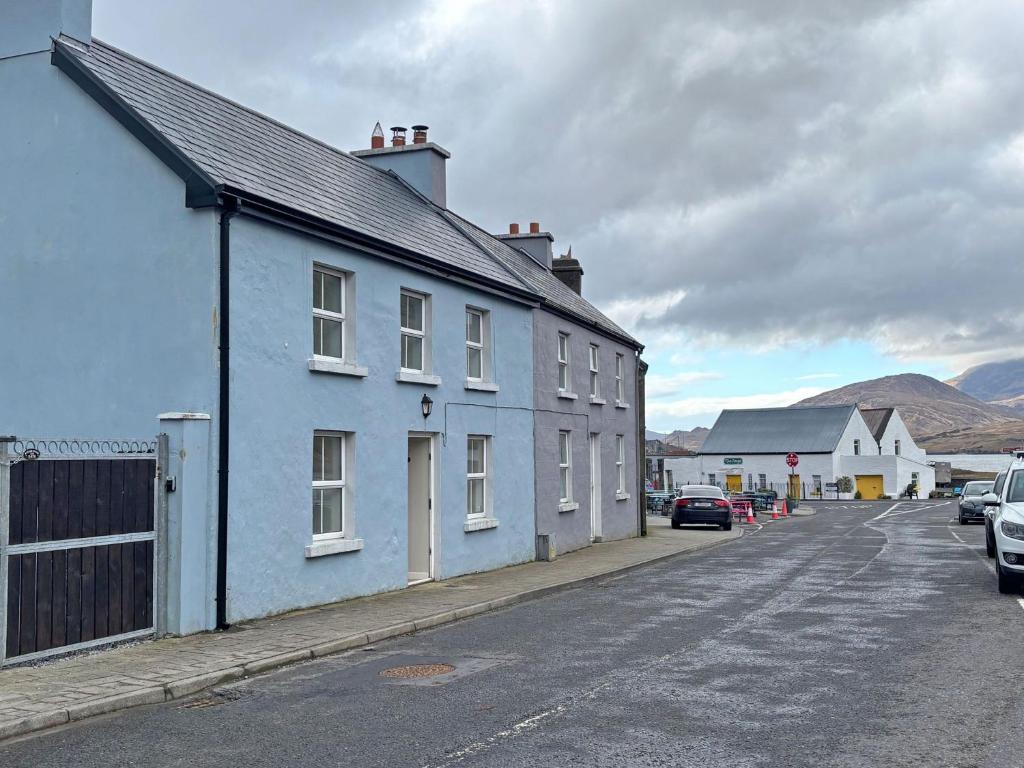 a blue building on the side of a street at Cottage 496 - Leenane in Leenaun