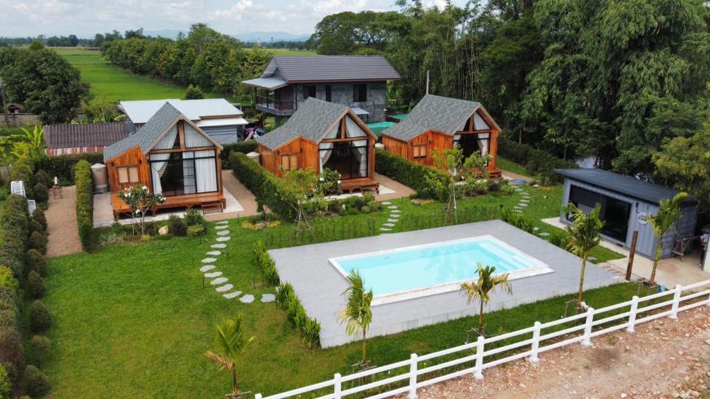 an aerial view of a house with a swimming pool at Tuyo Homestay in Ban Pang Kiang