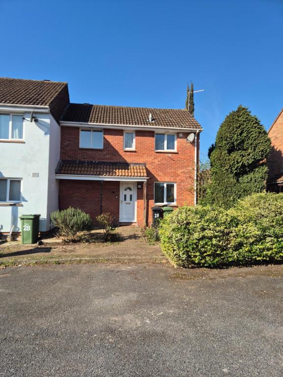 a red brick house with a white door at Rome avenue in Abingdon