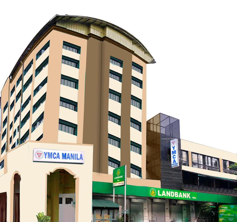 a large building with a sign on the side of it at YMCA of Manila Hostel in Sampong
