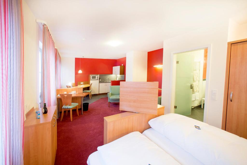 Postel nebo postele na pokoji v ubytování Hotel Weisses Lamm