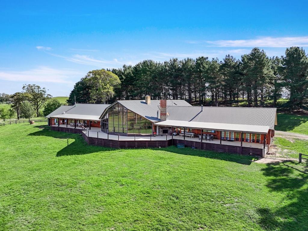 an aerial view of a large building in a field at The Lodge at Eagle Rock Farm, in Mandemar
