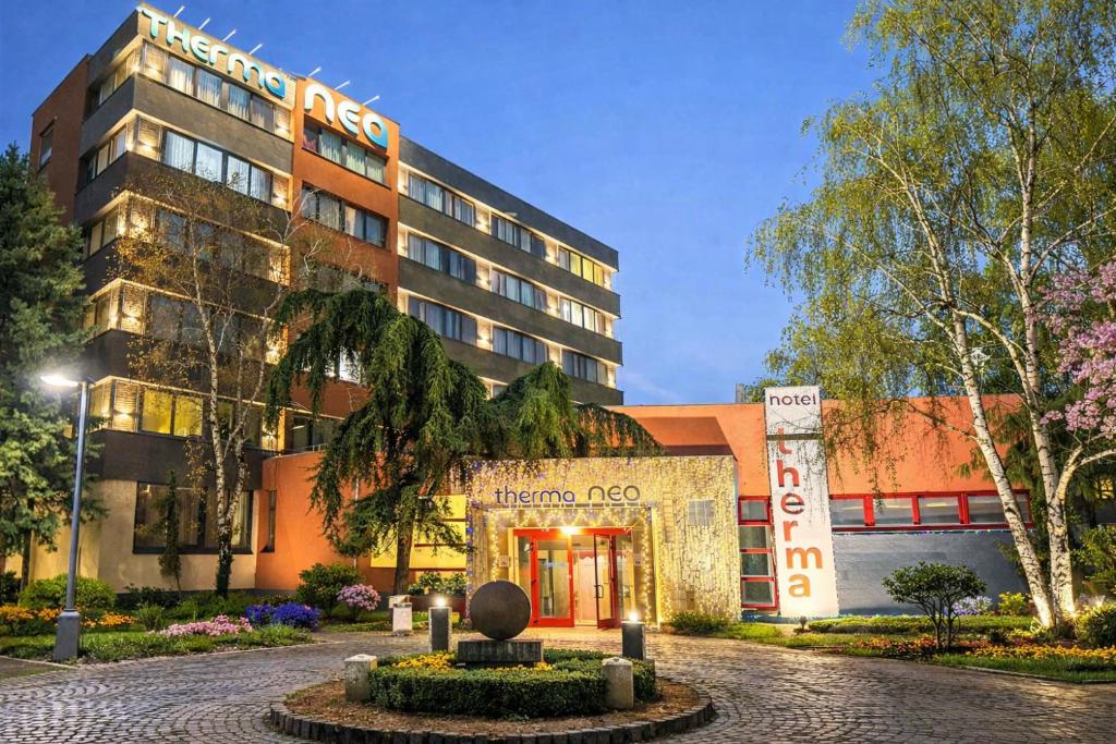 a hotel in front of a building at Therma Nea Dunajská Streda in Dunajská Streda