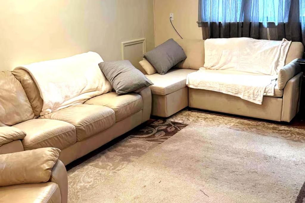 a living room with two couches and a couch at Economy 3 beds in Moorhead
