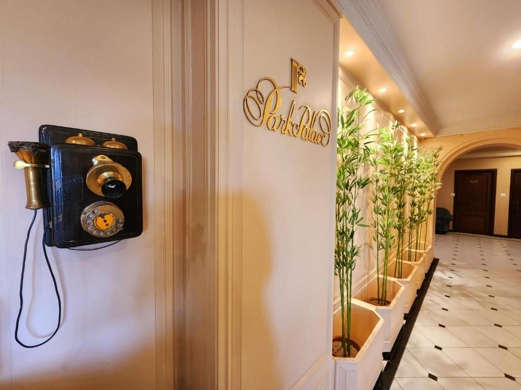 a hallway with a camera on the wall at Park Palace Hotel in Kolkata