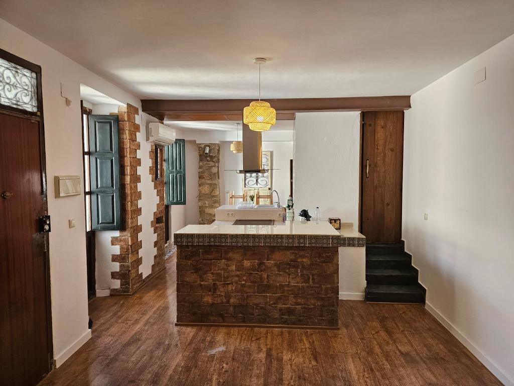 a large bathroom with a sink and a mirror at Cathedral Suite Jaén in Jaén