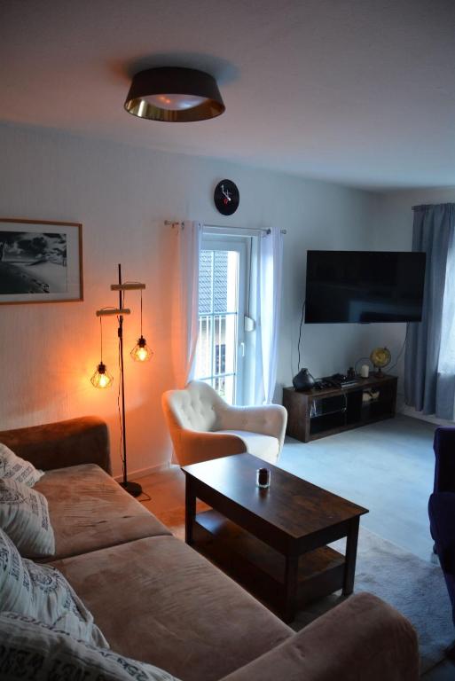 a living room with a couch and a coffee table at Zur Eresburg in Marsberg