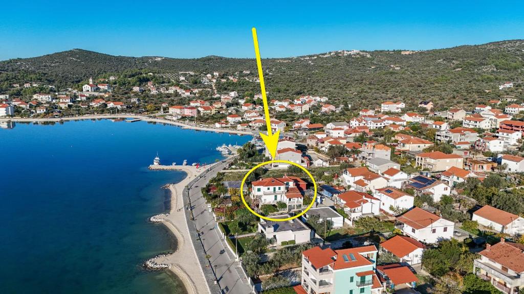 an aerial view of a town next to a body of water at Apartments Srdan in Vinišće