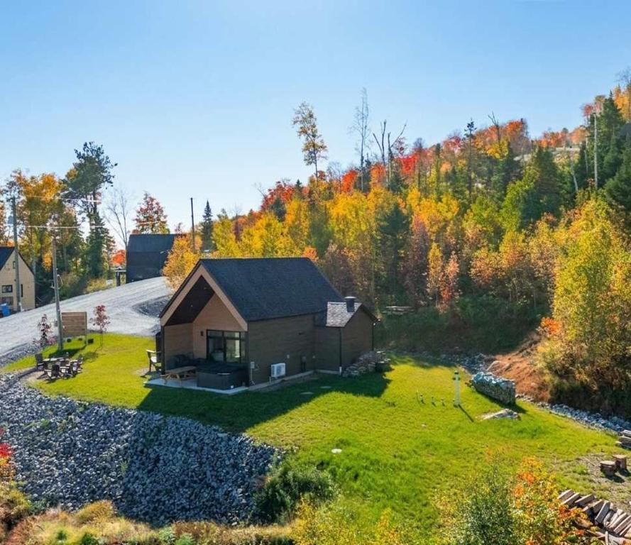 an aerial view of a small house in the woods at Spa and Mountain - Chalet OslO42 in Saint Come