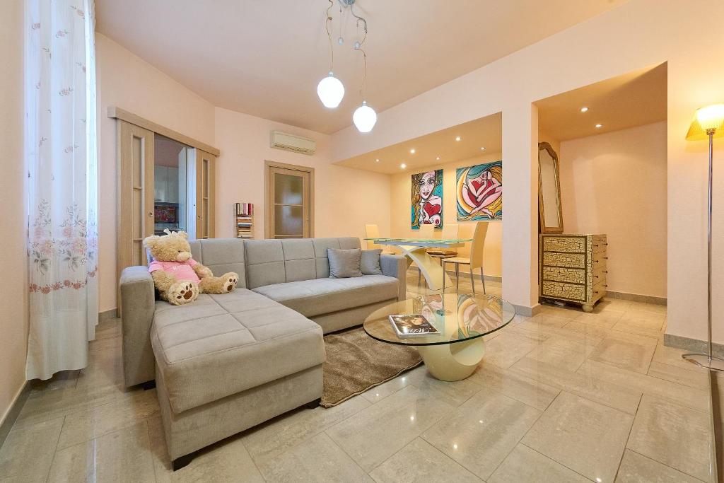 a living room with a couch and a table at Rosamare - Follonica in Follonica