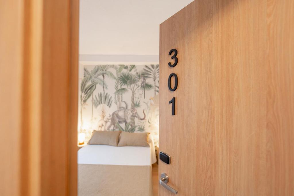 an open door with a bed in a bedroom at Hotel BH Los Ángeles in Benidorm