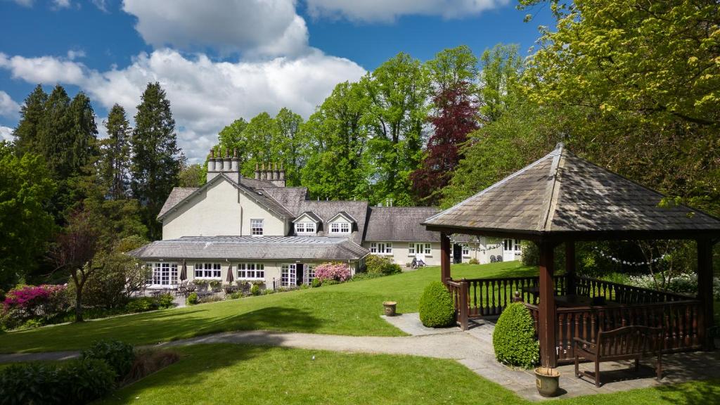 a large white house with a gazebo at Briery Wood Hotel in Ambleside