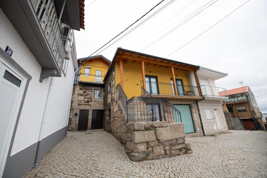 a group of buildings sitting next to each other at Casa Avó Libânia in Murça