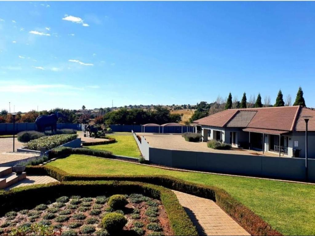 a view of a house with a garden at 2nd Cozy Corner in Highlands