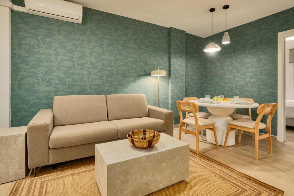 a living room with a couch and a table at MOON Apartments in Seville