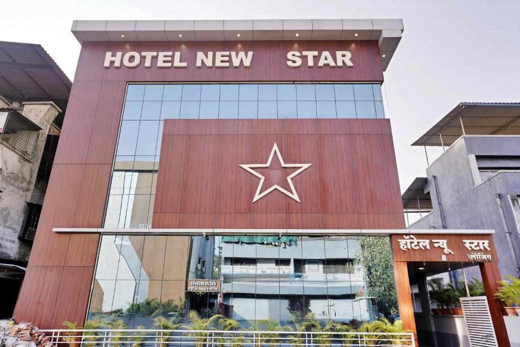 a hotel new star sign on top of a building at Hotel New Star in Navi Mumbai