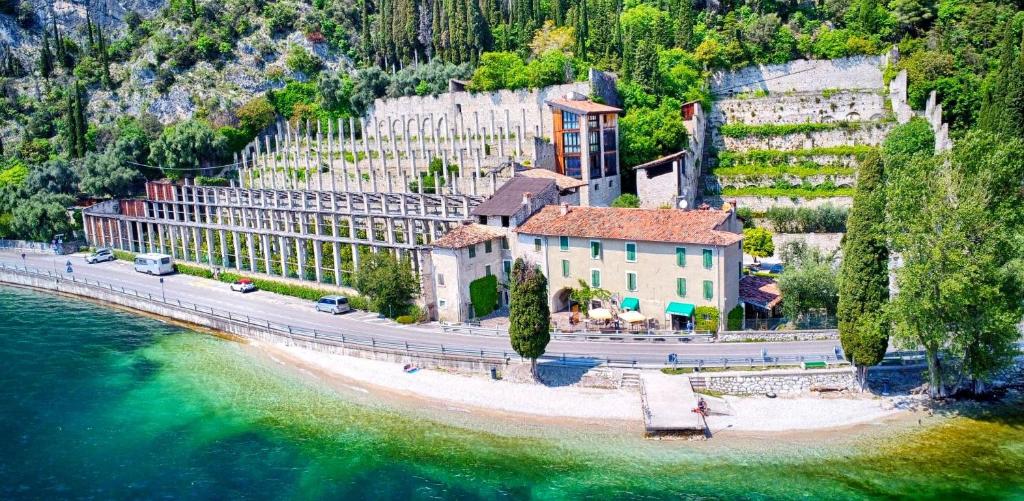 an aerial view of a resort next to a body of water at Prà de la Fam Hotel & Apartments in Tignale