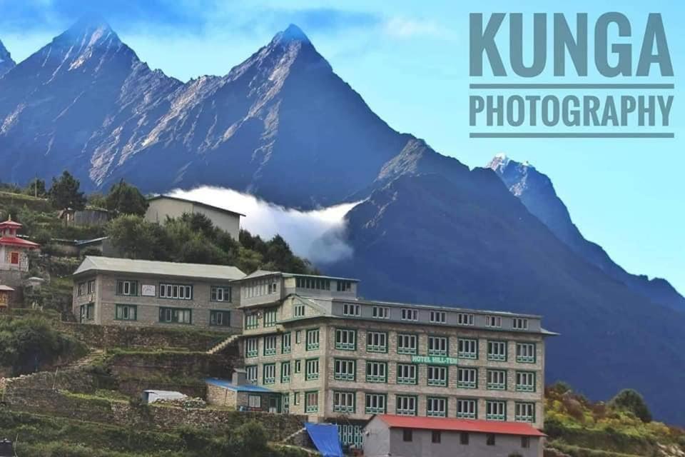 a picture of a building with a mountain in the background at Hill-Ten in Namche