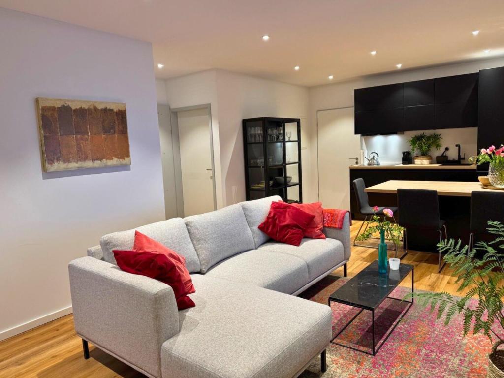 a living room with a couch and a piano at Top Apartment in Kranenburg - central & quiet - terrace and large windows - incl parking, fast WiFi, Box-Spring bed, washer & dryer, Netflix in Kranenburg