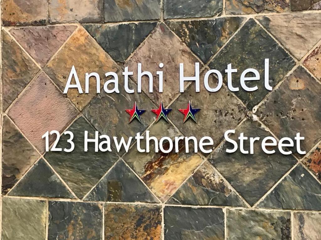 a stone floor with the words authentic hotel hawthorne street at Anathi Hotel in Kokstad