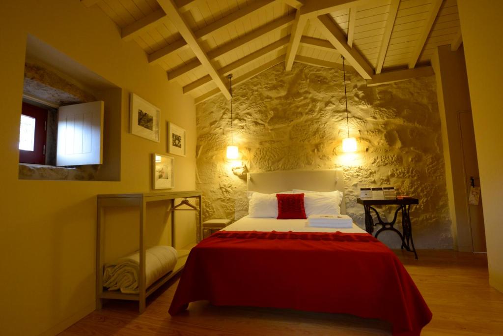Cama ou camas em um quarto em Casa de Docim